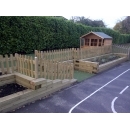 new wooden flowerbeds and wooden fencing